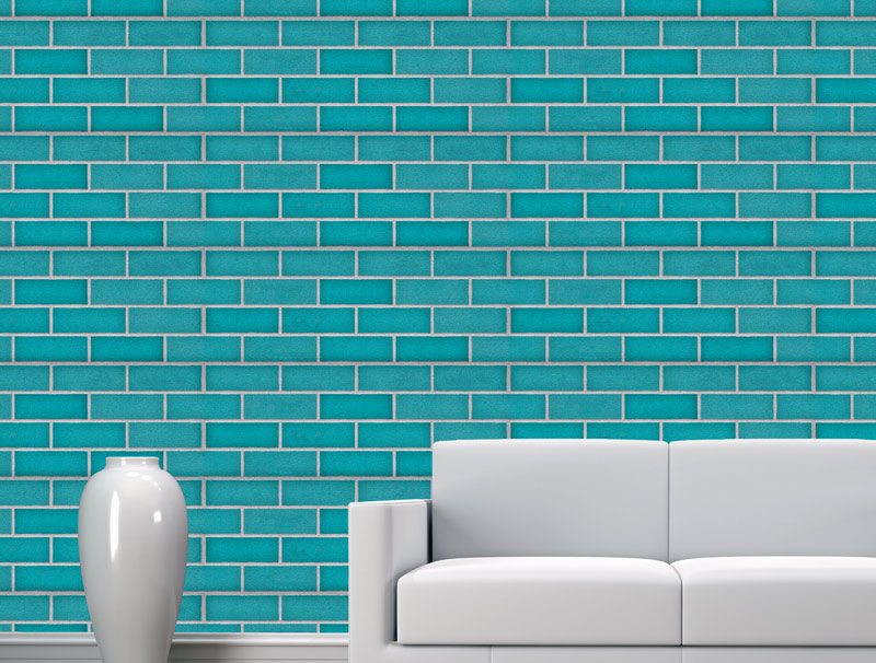 A turquoise brick wall