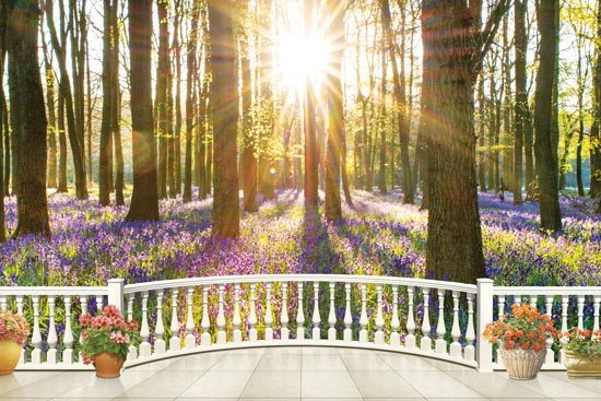 Balcony overlooks a beautiful forest with purple flowers