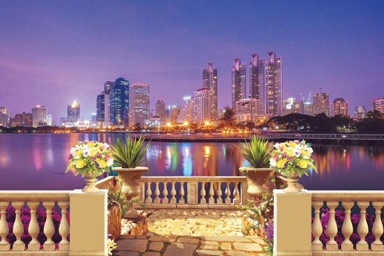 Wallpaper of a balcony with a beautiful view of a city in shades of purple