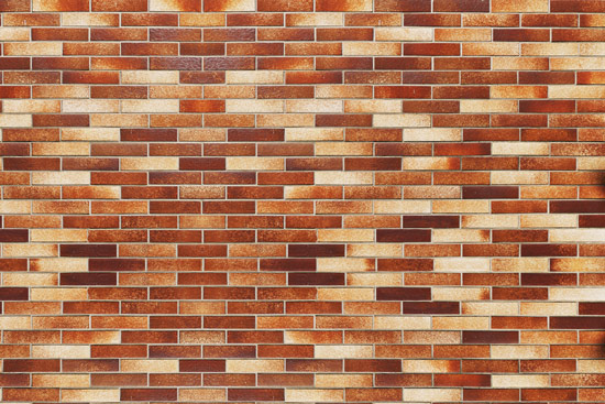 Wallpaper - brick wall in shades of orange brown