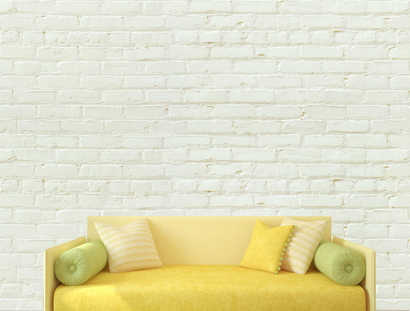 Pastel light yellow colored brick wallpaper